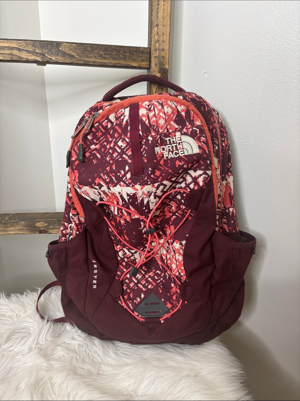 The North Face Jester Backpack in Burgundy and Coral Pattern